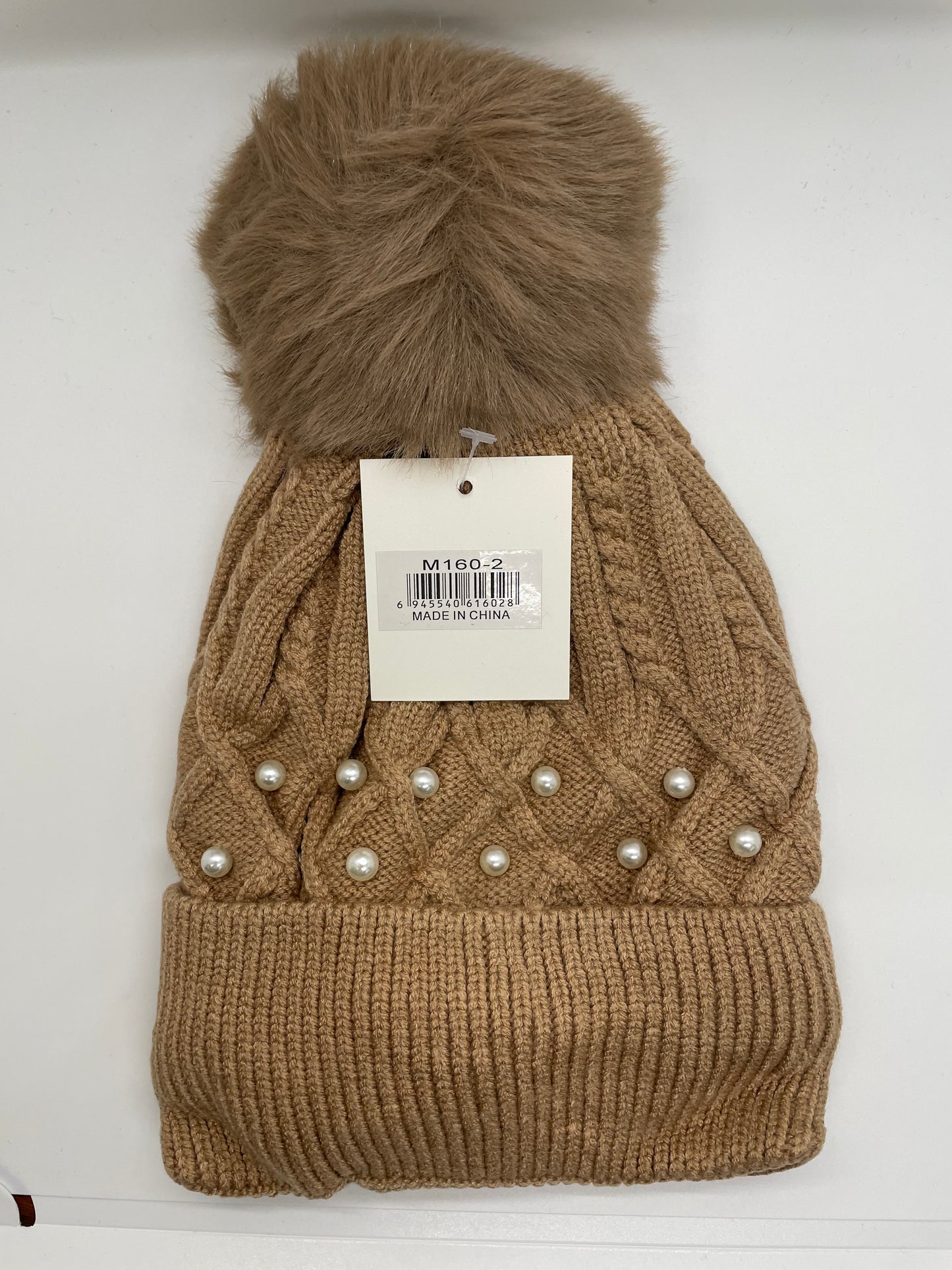 Orange women's toboggan hat with a quilted texture