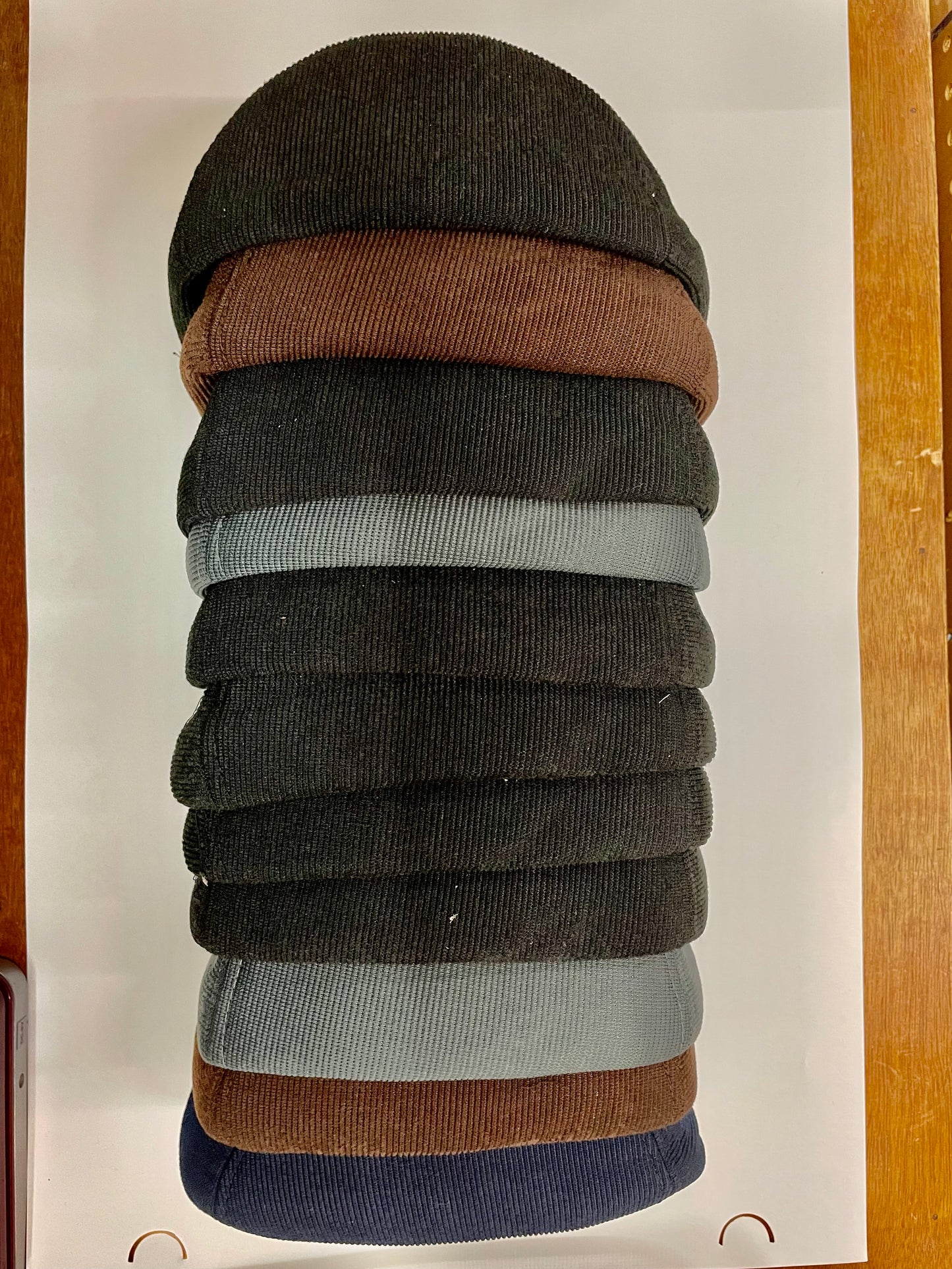 "Green winter hat with ear flaps and a stretchy fit"