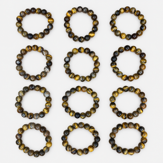 Complete 12-bracelet assortment of brown & gold round bead bracelets: 12 brown-and-gold round-bead bracelets with individual variations in bead markings.
