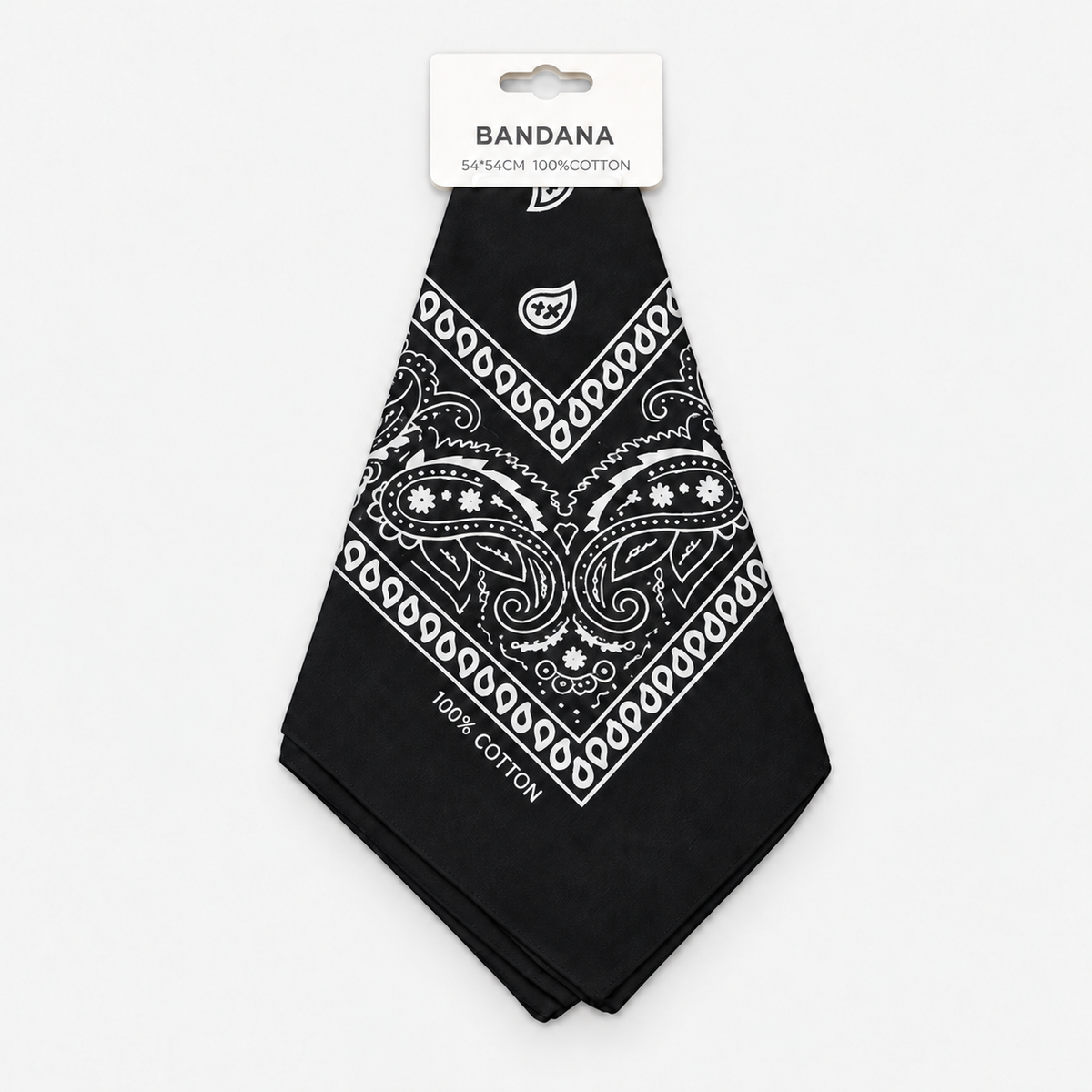 One black cotton paisley bandana with its retail hang tag on a light gray background.