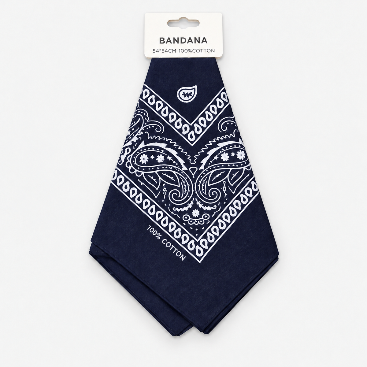 One navy cotton paisley bandana with retail hang tag on a light gray background.