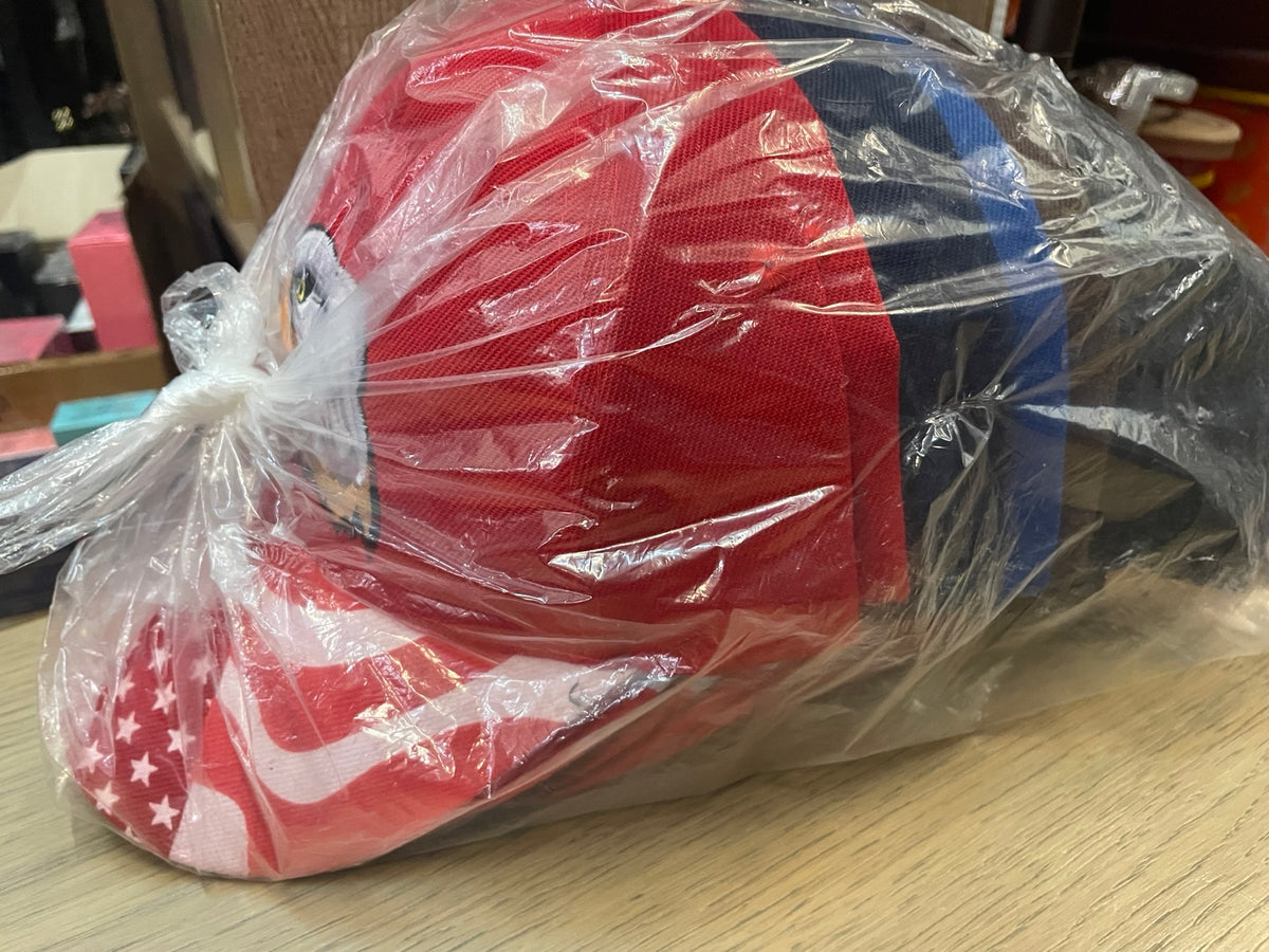Original side view of eagle caps packed in a clear bag
