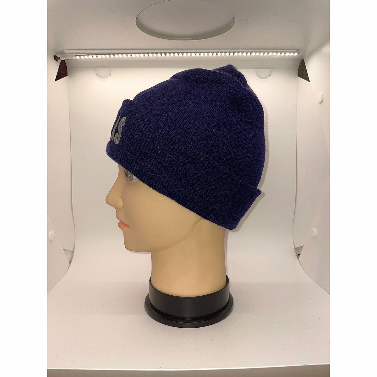 Side view of a navy cuffed beanie