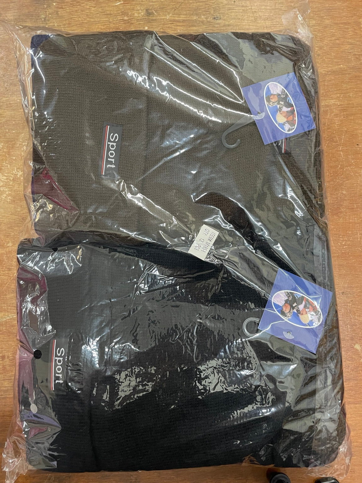 Original packaged insulated beanies showing dark brown and black Sport cuffed hats