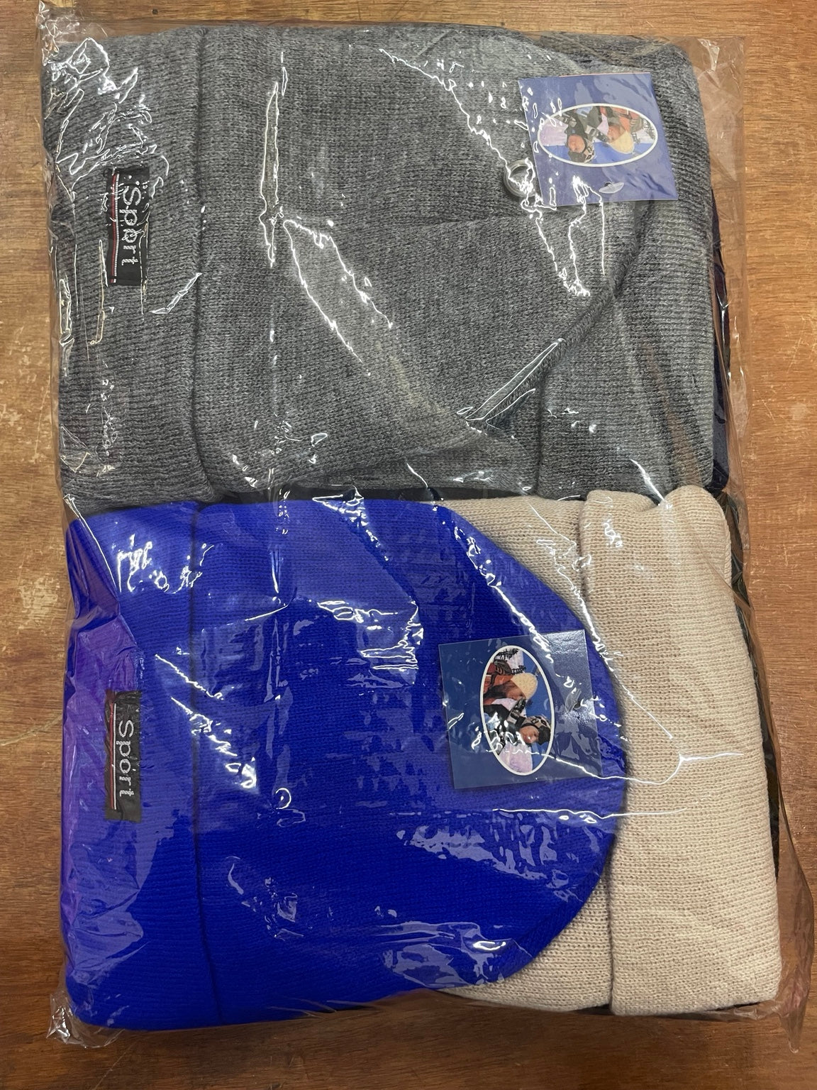 Original packaged insulated beanies showing gray, royal blue and cream Sport cuffed hats