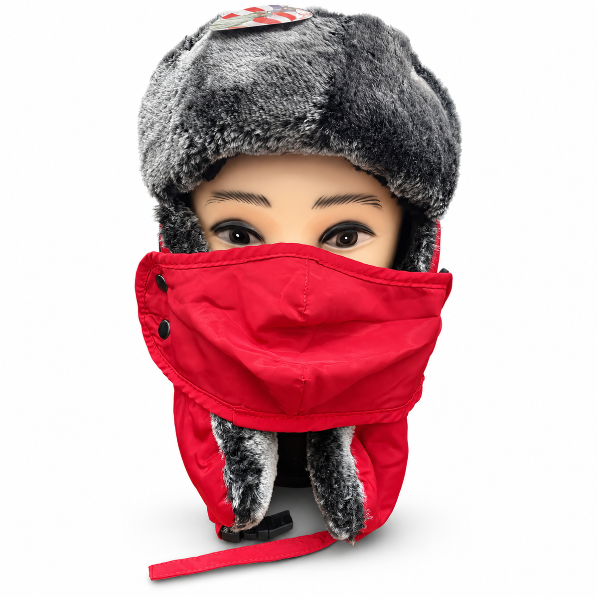 Red ushanka hat with face covering and gray furry trim on a mannequin, front view