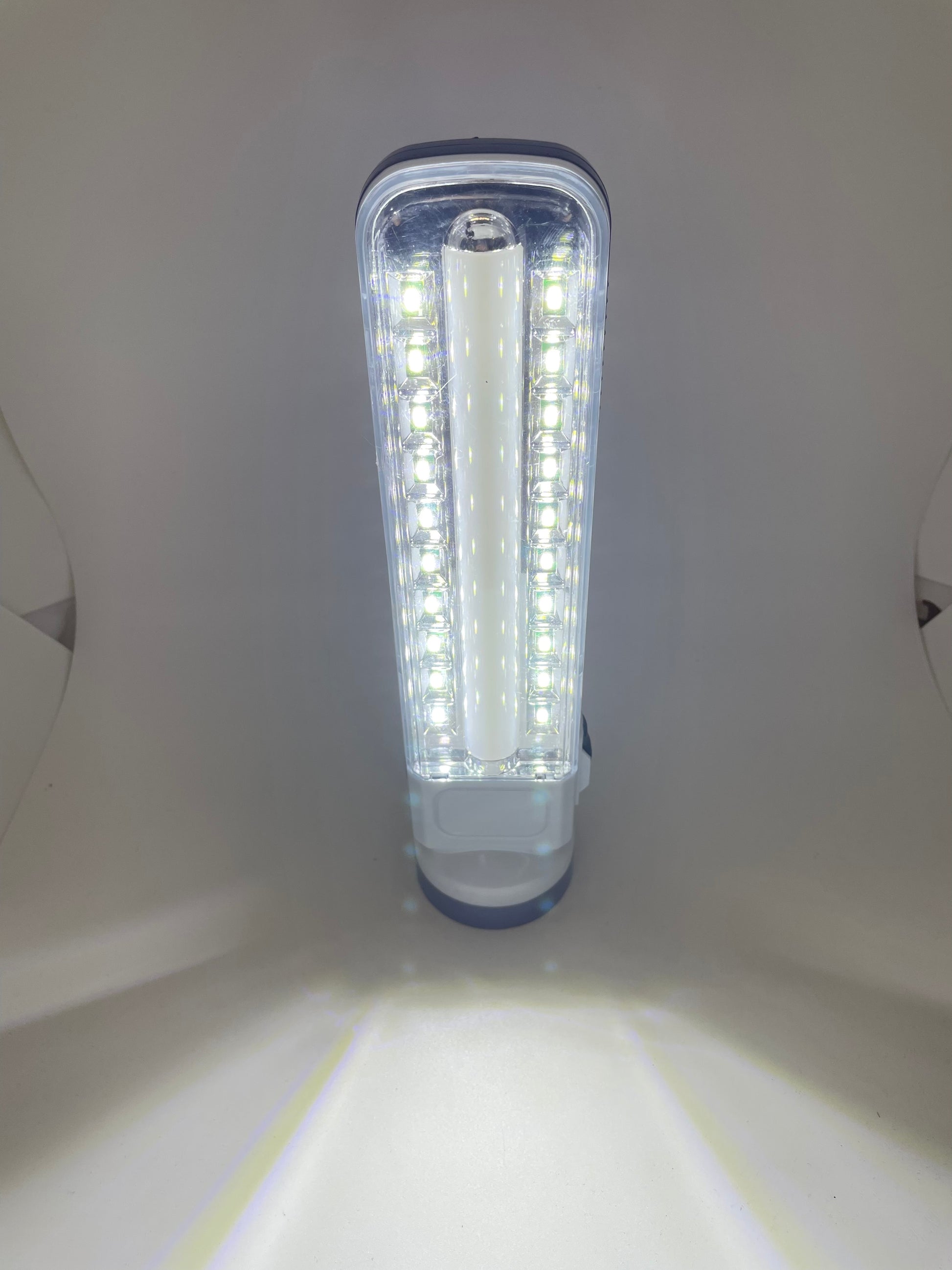 "White solar-powered rechargeable flashlight with a ribbed texture and a durable, water-resistant design"