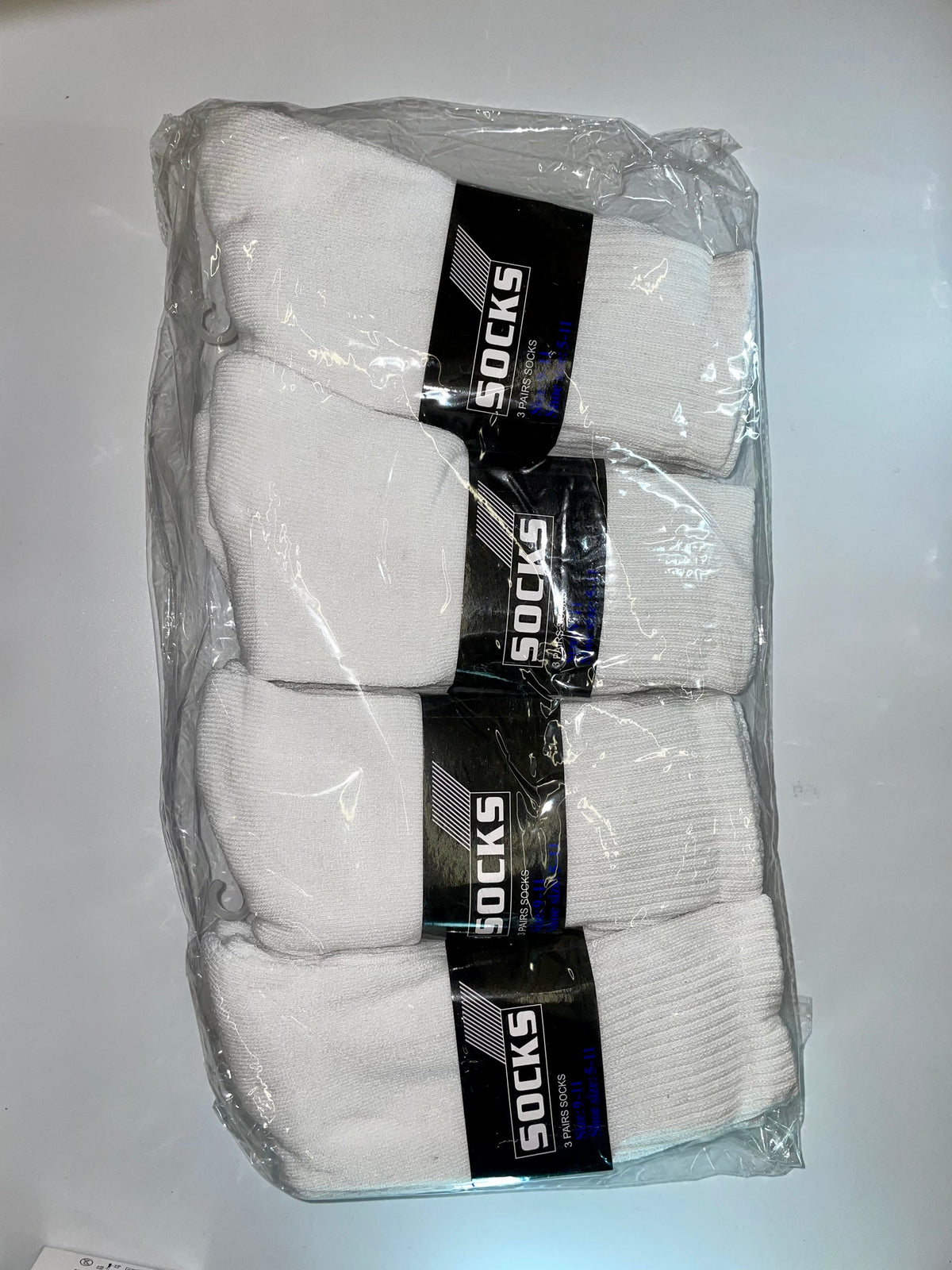 White crew socks in clear packaging