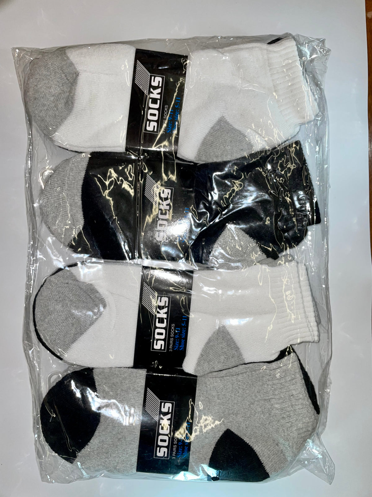Assorted white, black and gray men’s ankle socks