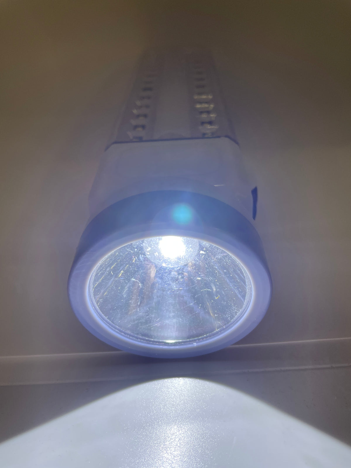Rechargeable flashlight with front lamp illuminated