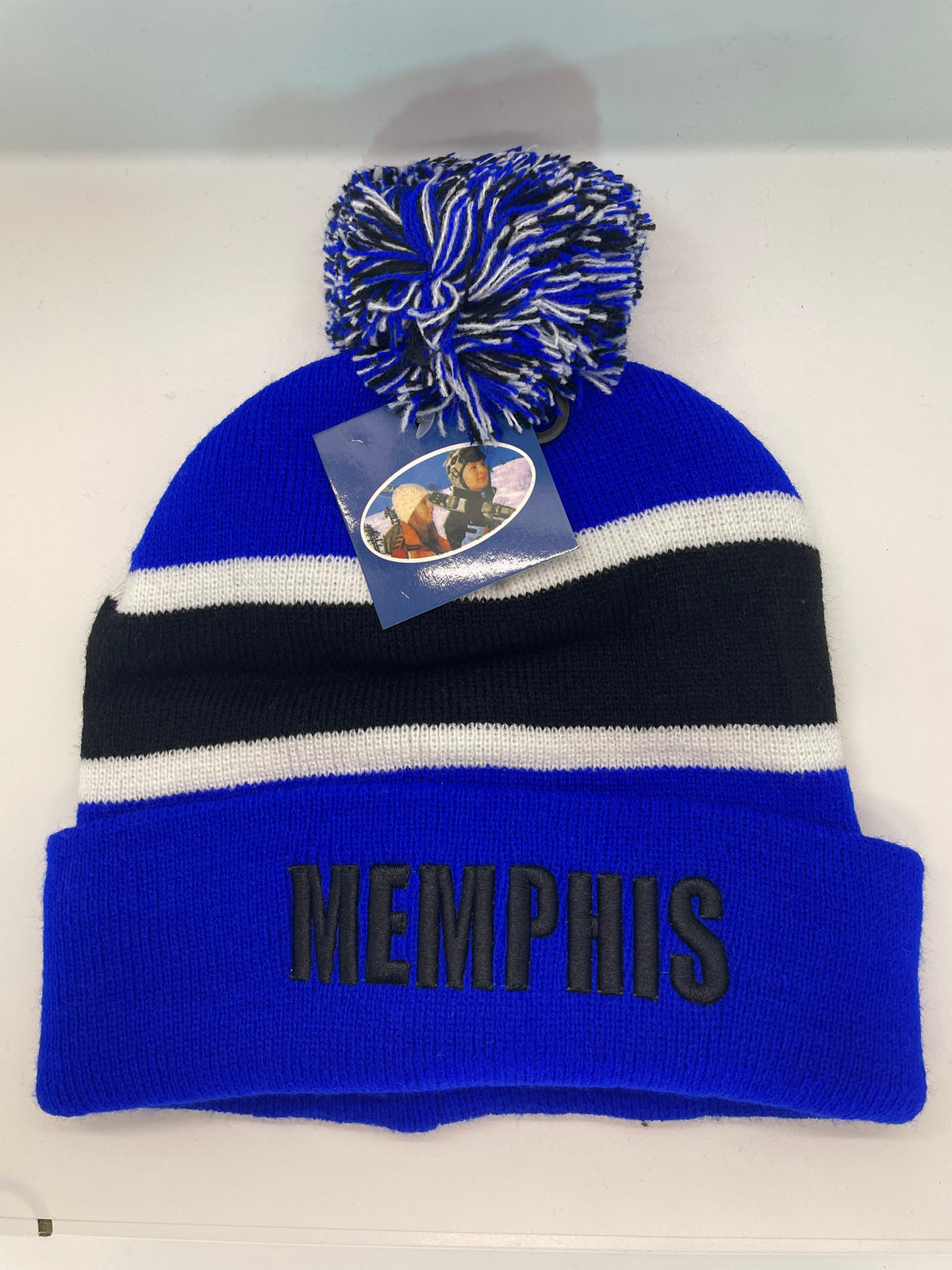 Blue Memphis pom-pom hat laid flat