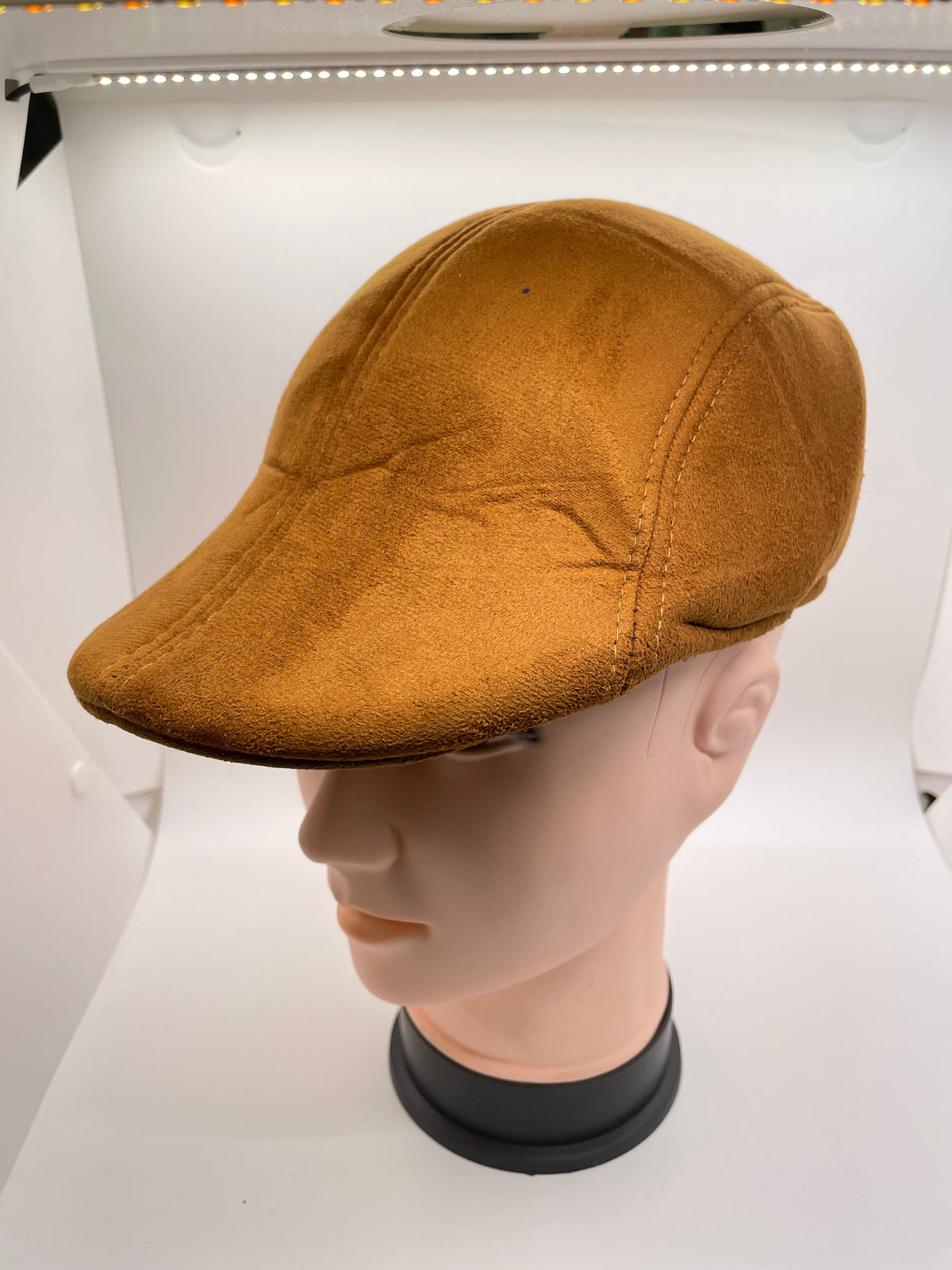 Tan flat hat with short brim