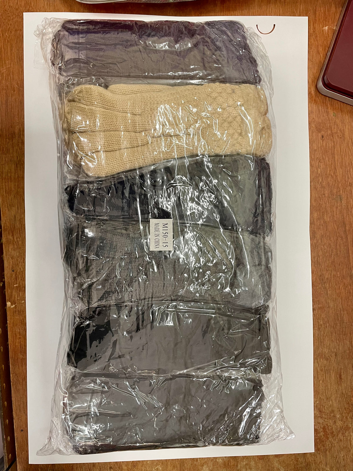 Packaged women’s winter gloves in assorted colors