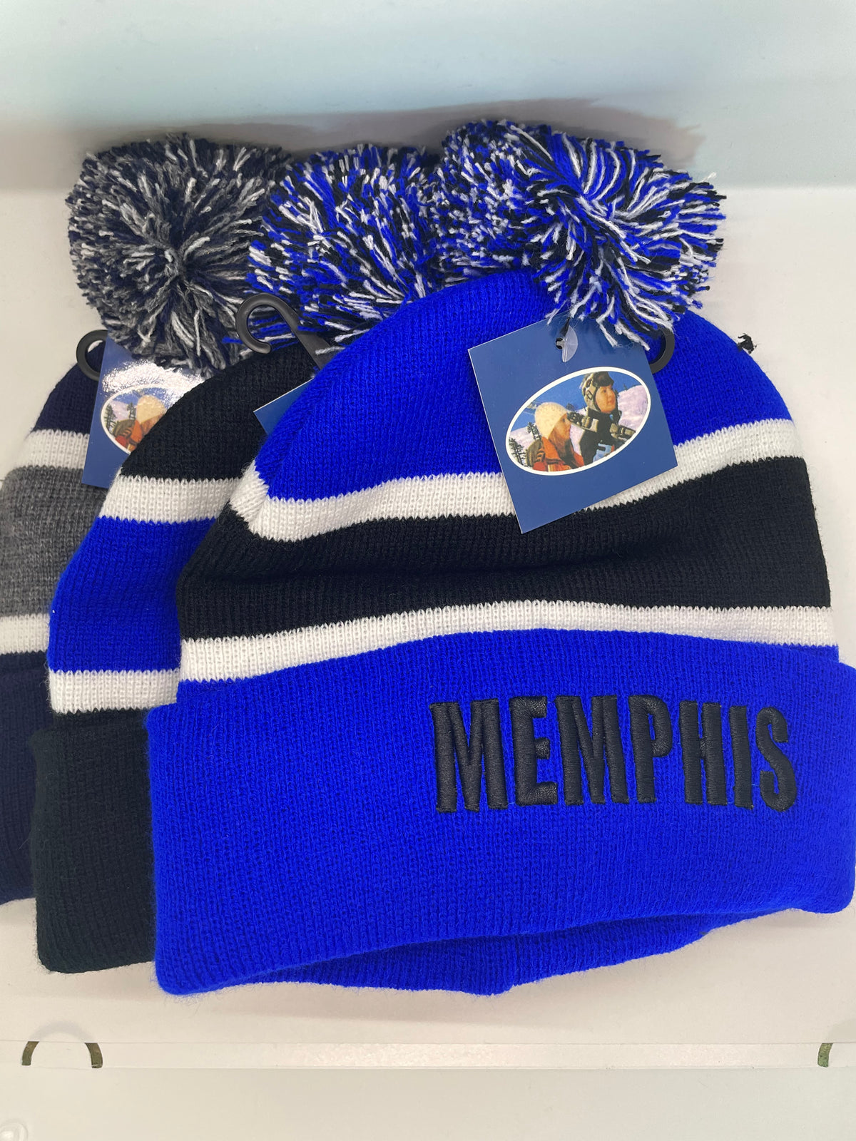 Memphis pom-pom hats in blue and dark color combinations