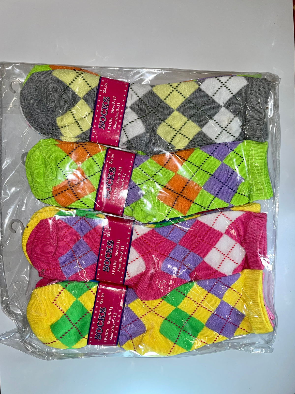 Packaged women’s crew socks with argyle patterns