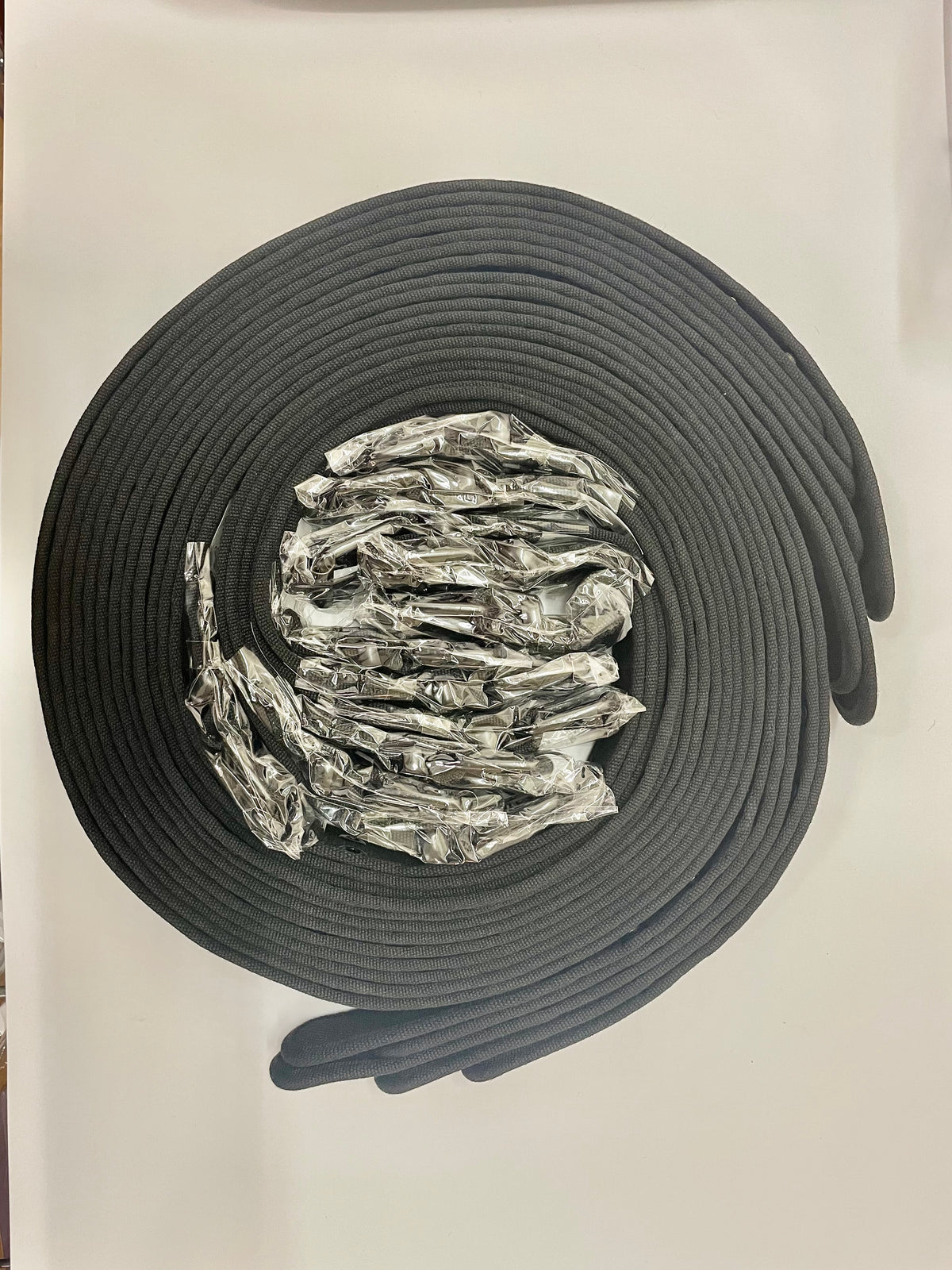 Coiled black belts with packaged buckles