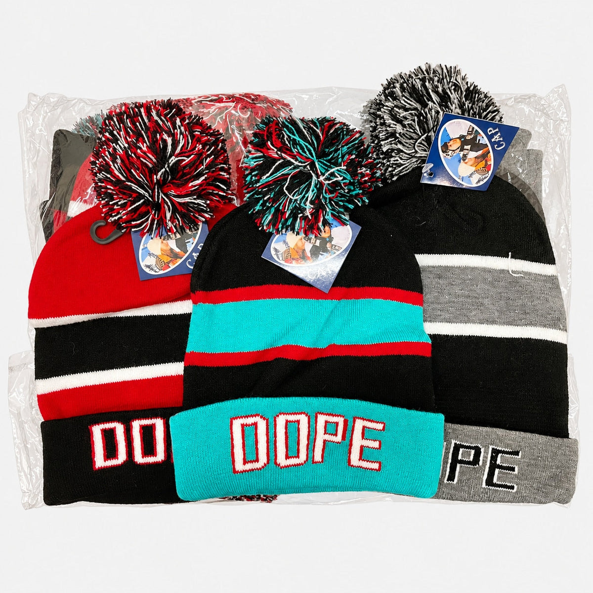 Striped Dope pom-pom beanies in several color combinations