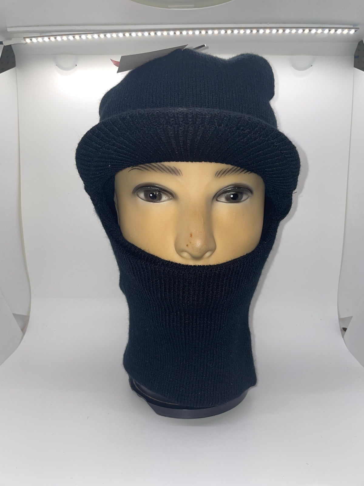 Black brimmed ski mask on a mannequin