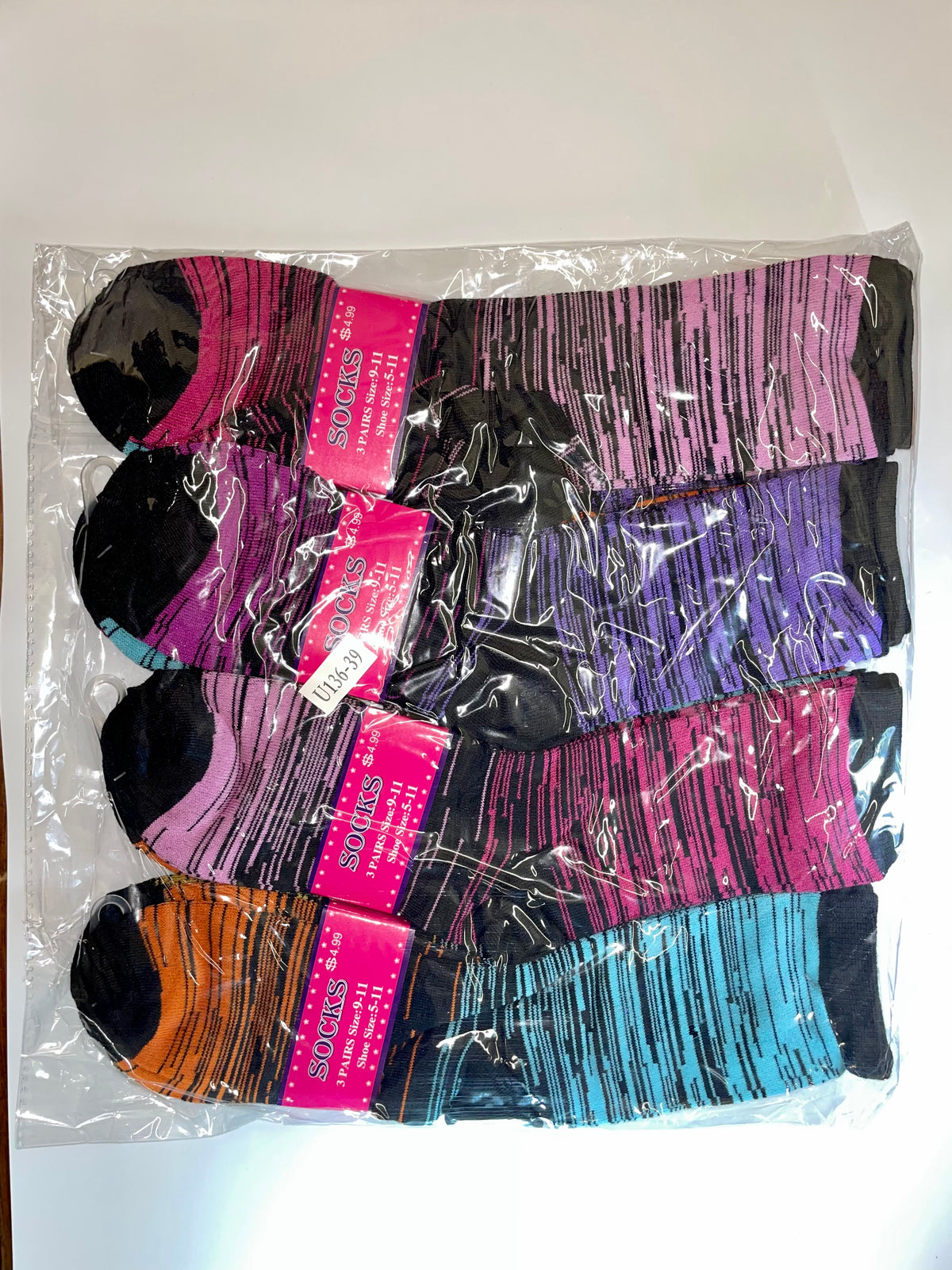 Packaged women’s crew socks with fine stripe patterns