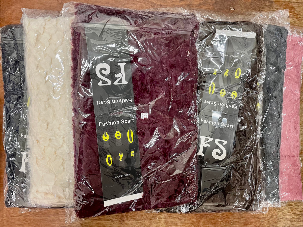Packaged infinity scarves in several colors
