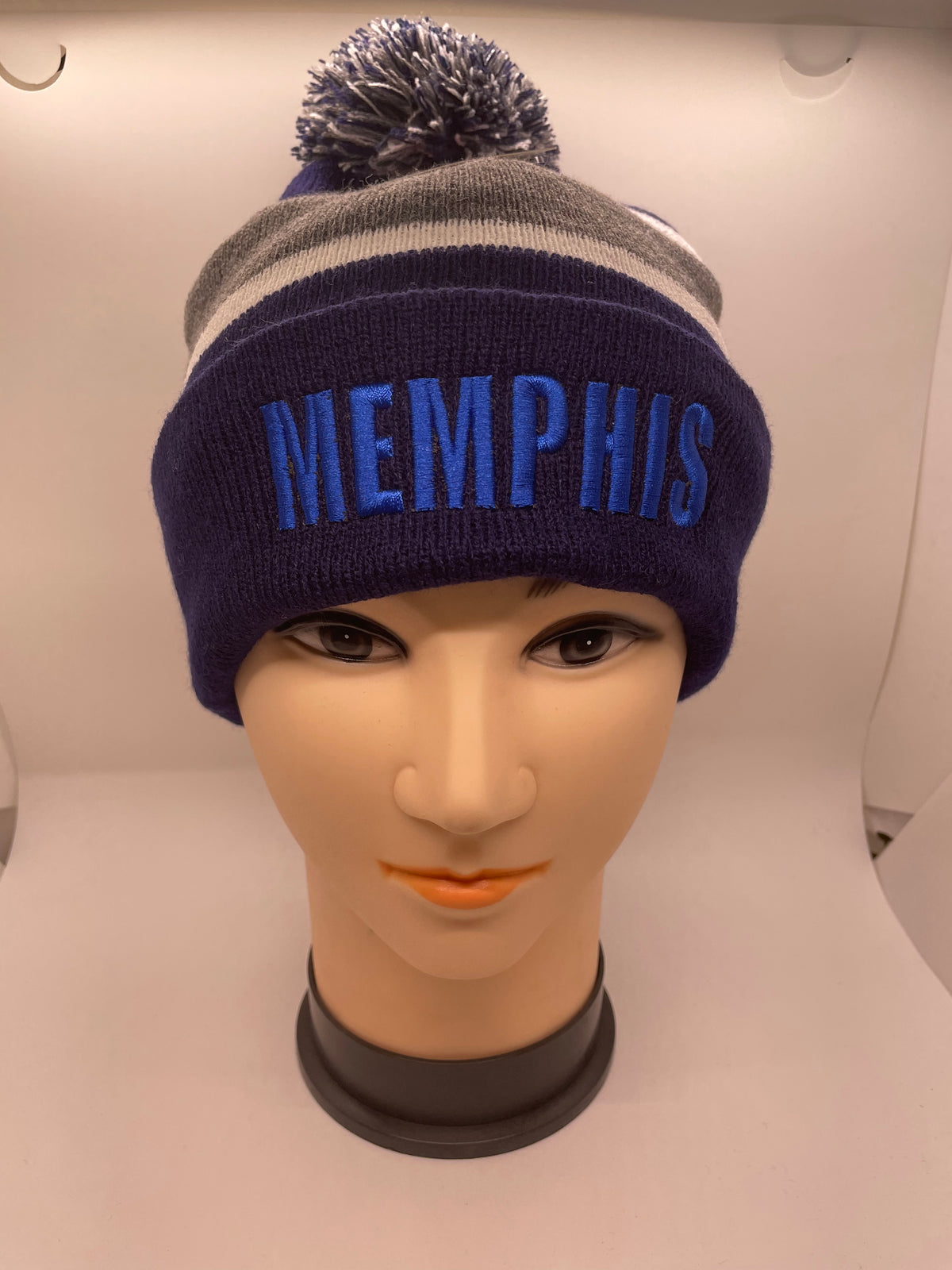 Dark Memphis pom-pom hat with striped crown