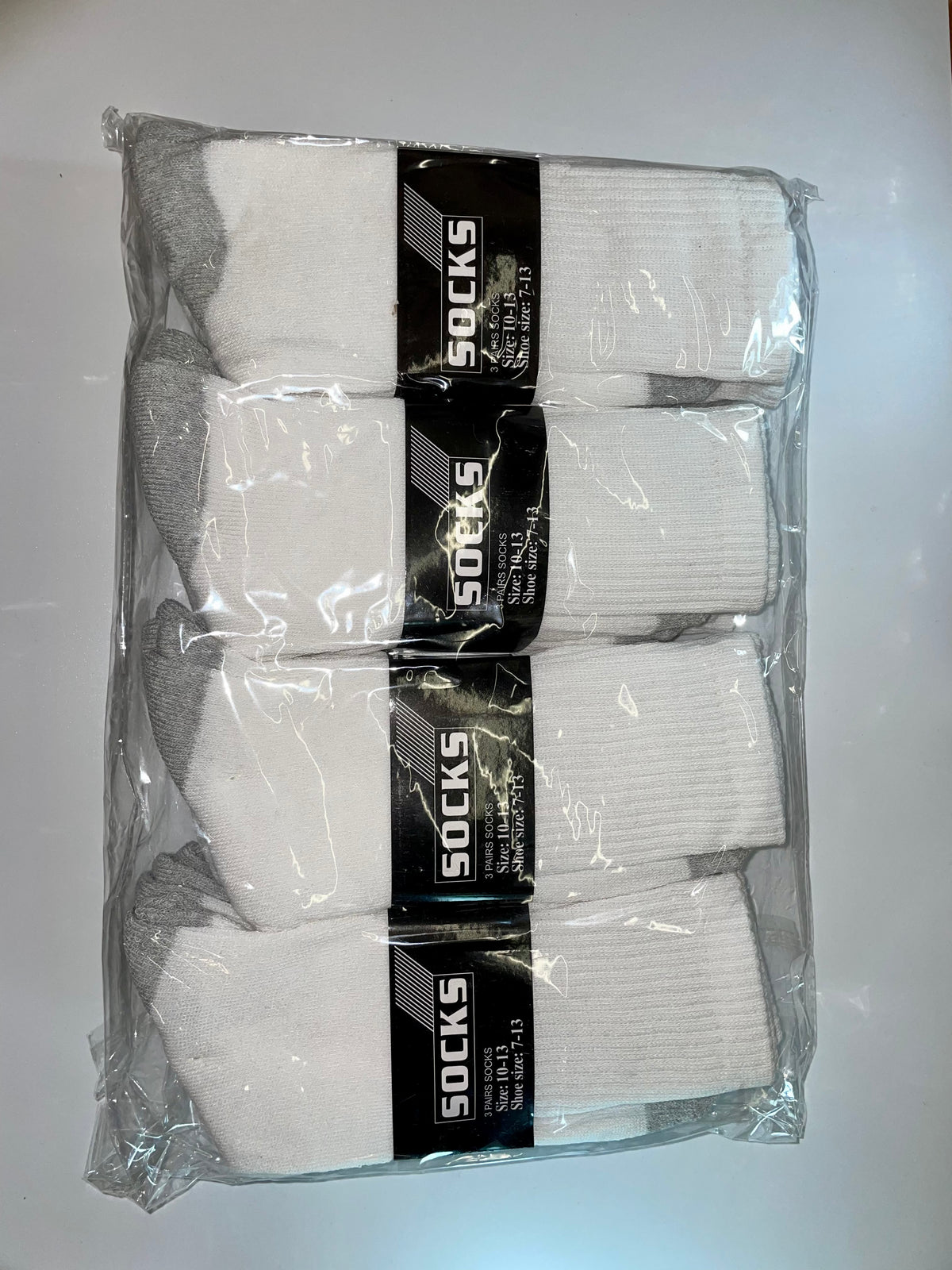 Packaged gray crew socks