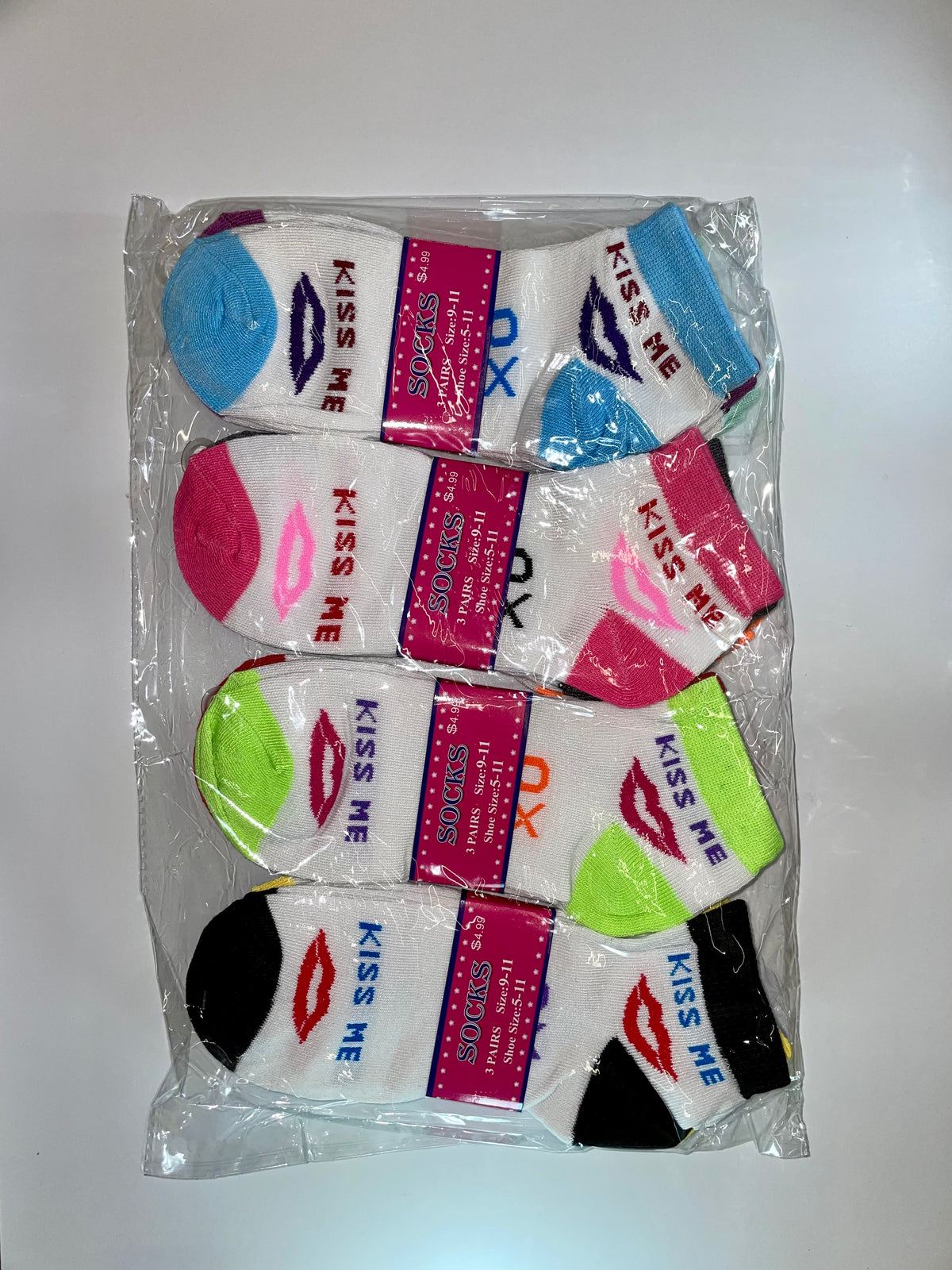 Packaged women’s ankle socks with text and stripe designs