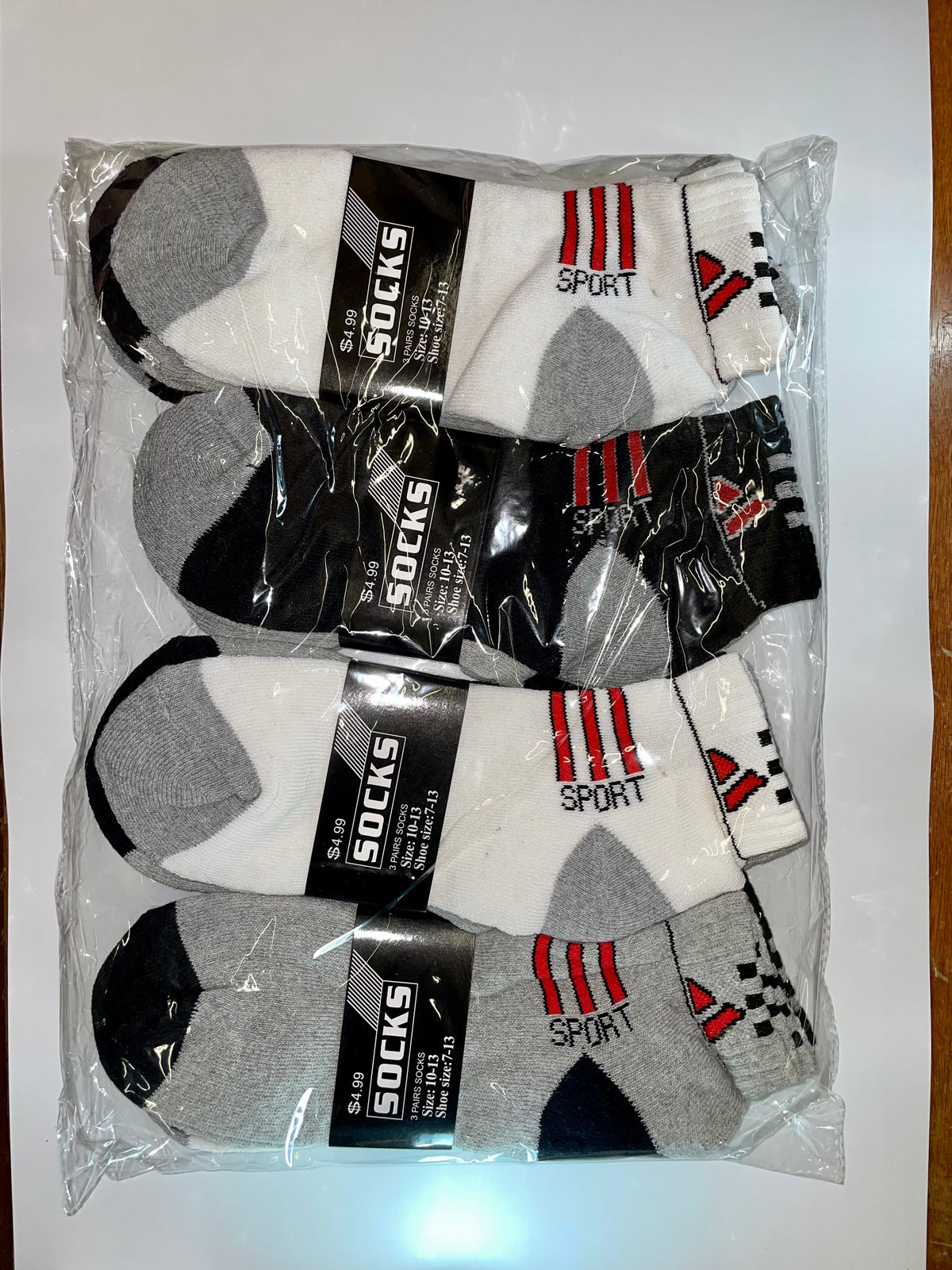 Men’s ankle socks with sport designs in clear packaging