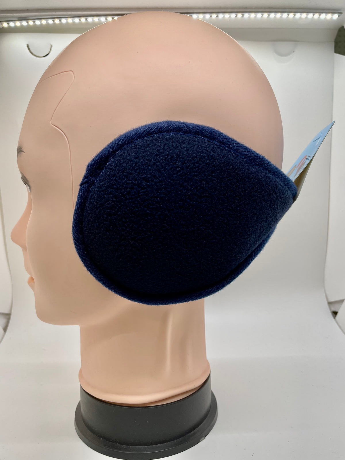 Navy ear muffs on a mannequin