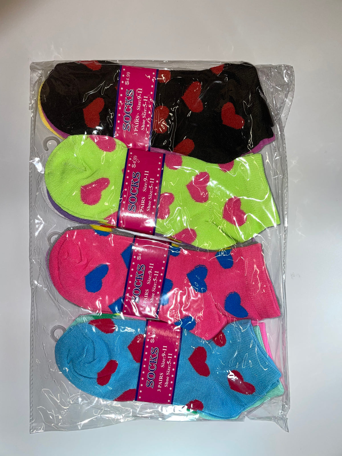 Packaged women’s ankle socks with heart patterns