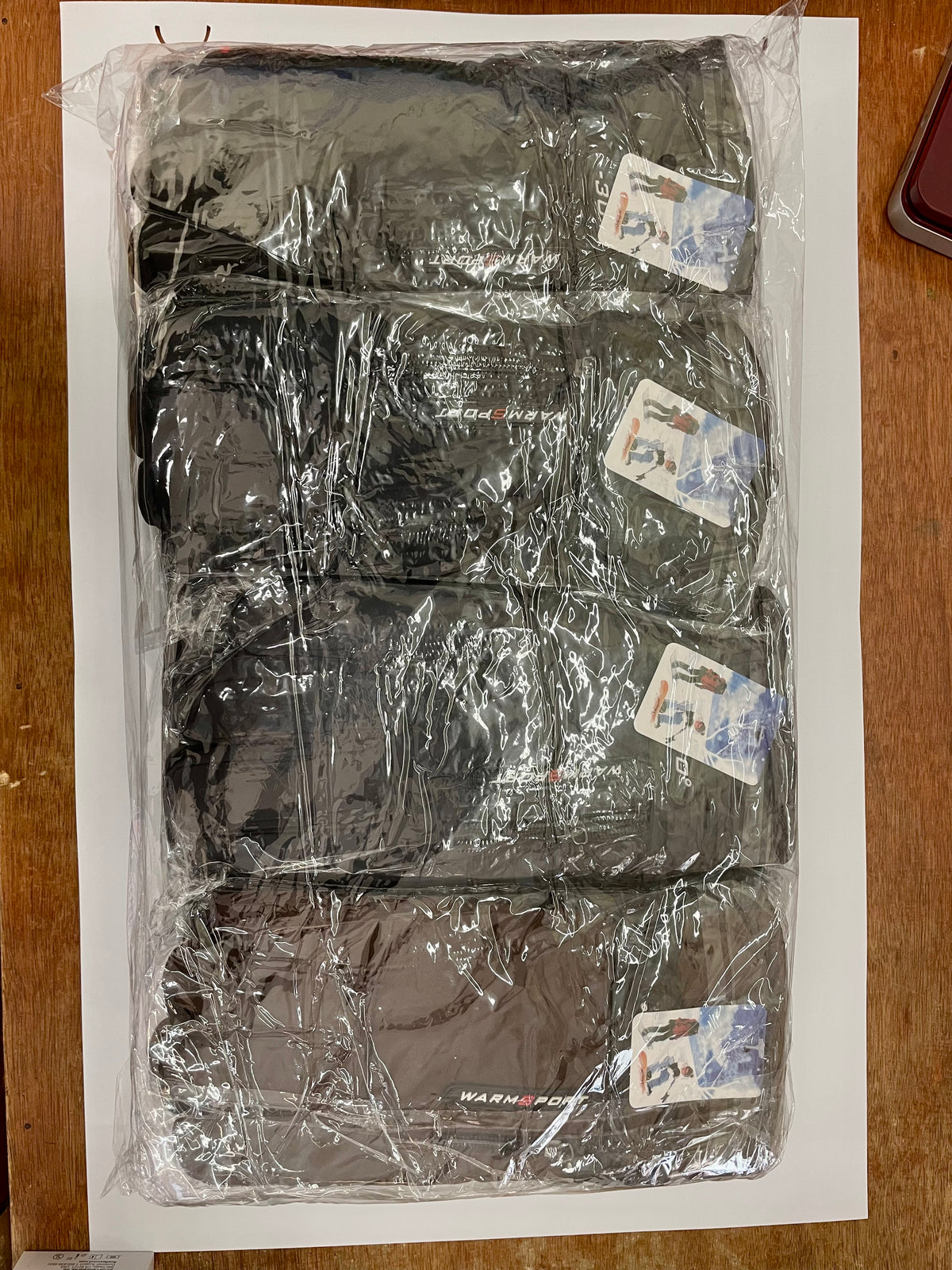 Packaged insulated winter gloves in several colors