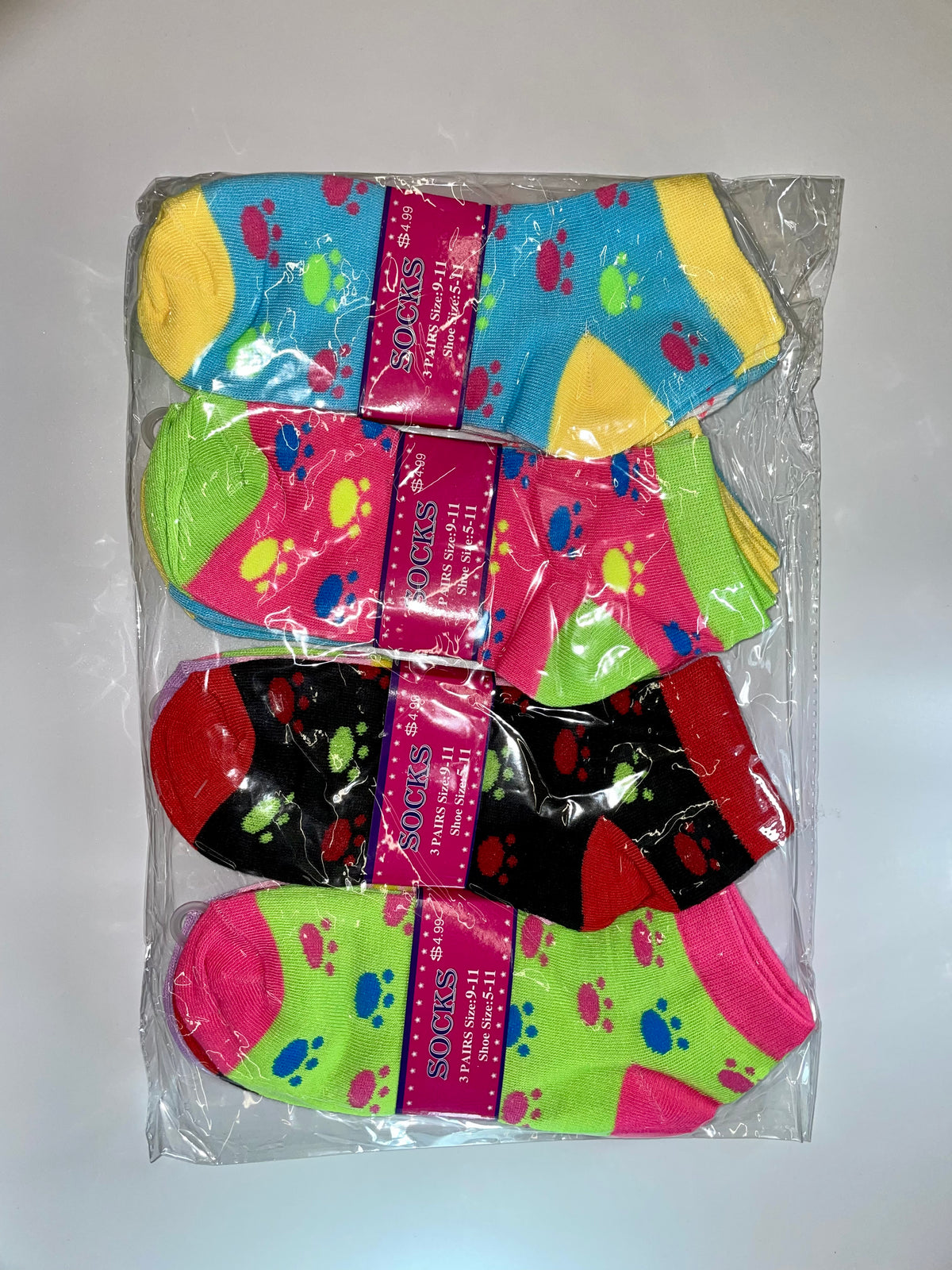 Packaged women’s ankle socks with paw-print patterns