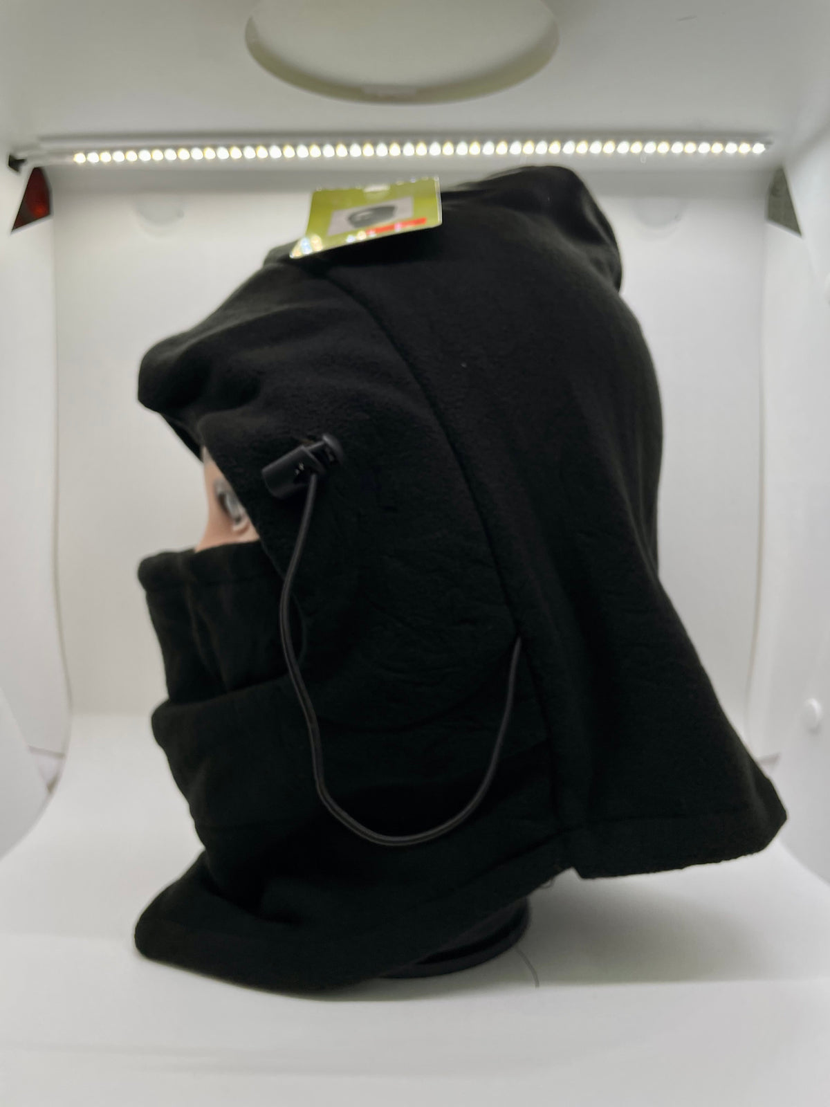 Black face-covering hood shown from the side