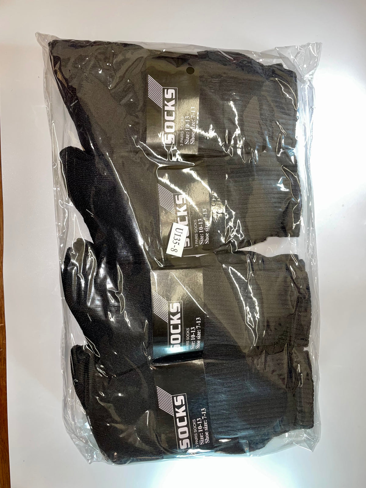 Packaged dark crew socks