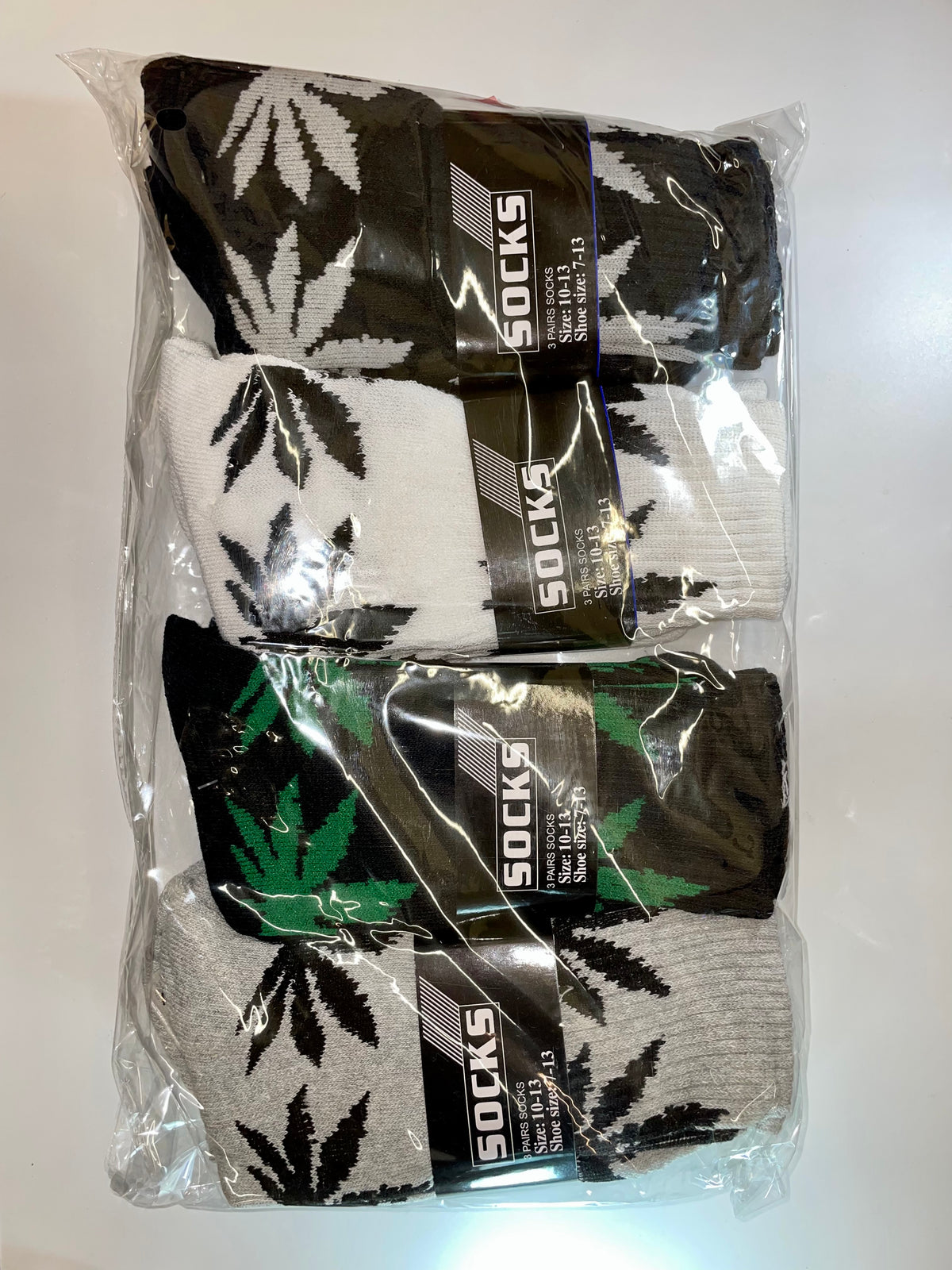 Packaged crew socks with leaf patterns