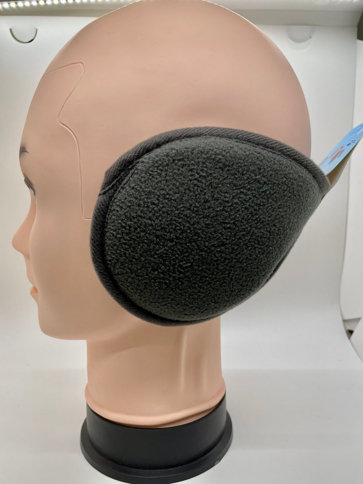 Gray ear muffs on a mannequin