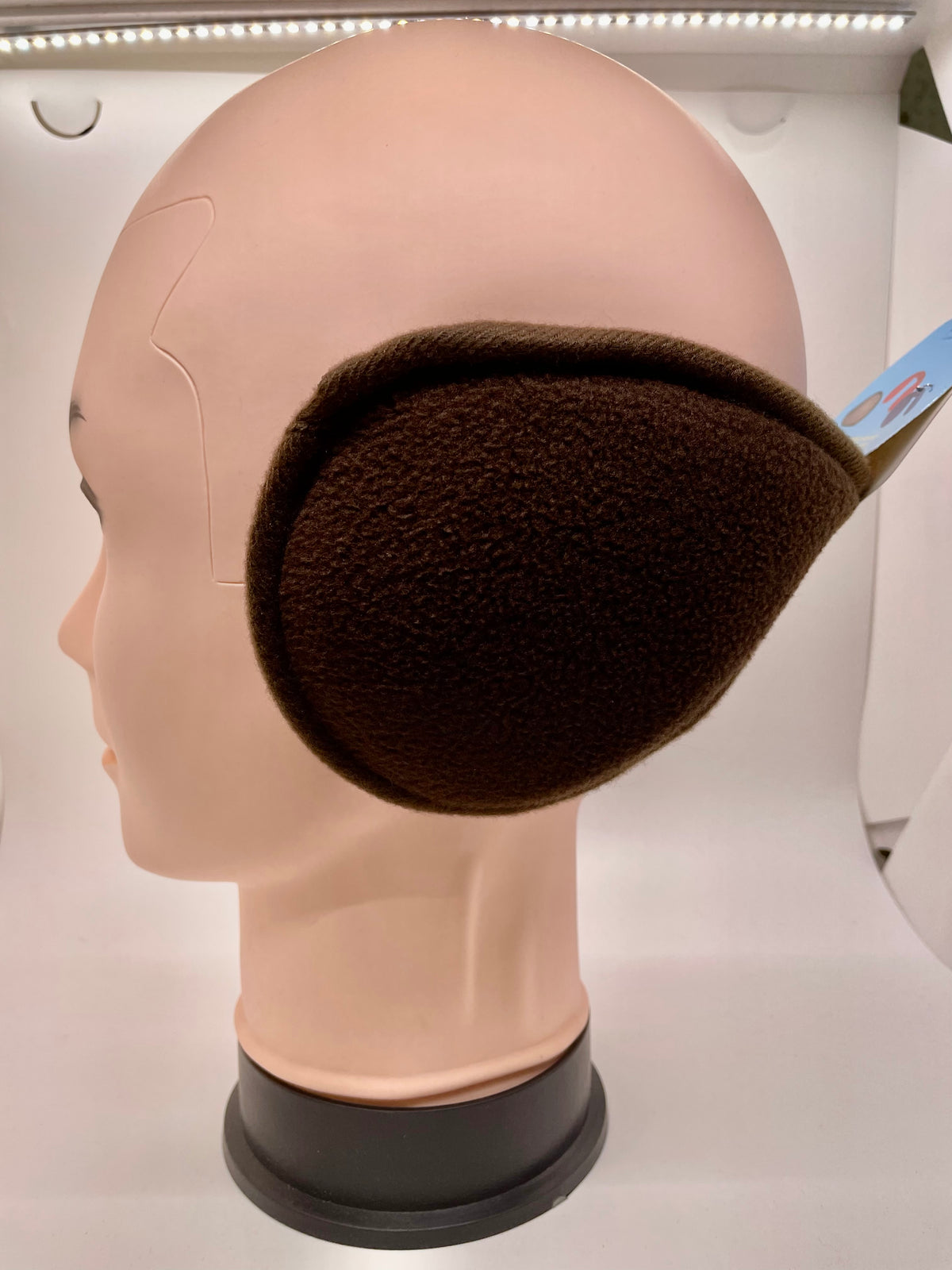 Brown ear muffs on a mannequin