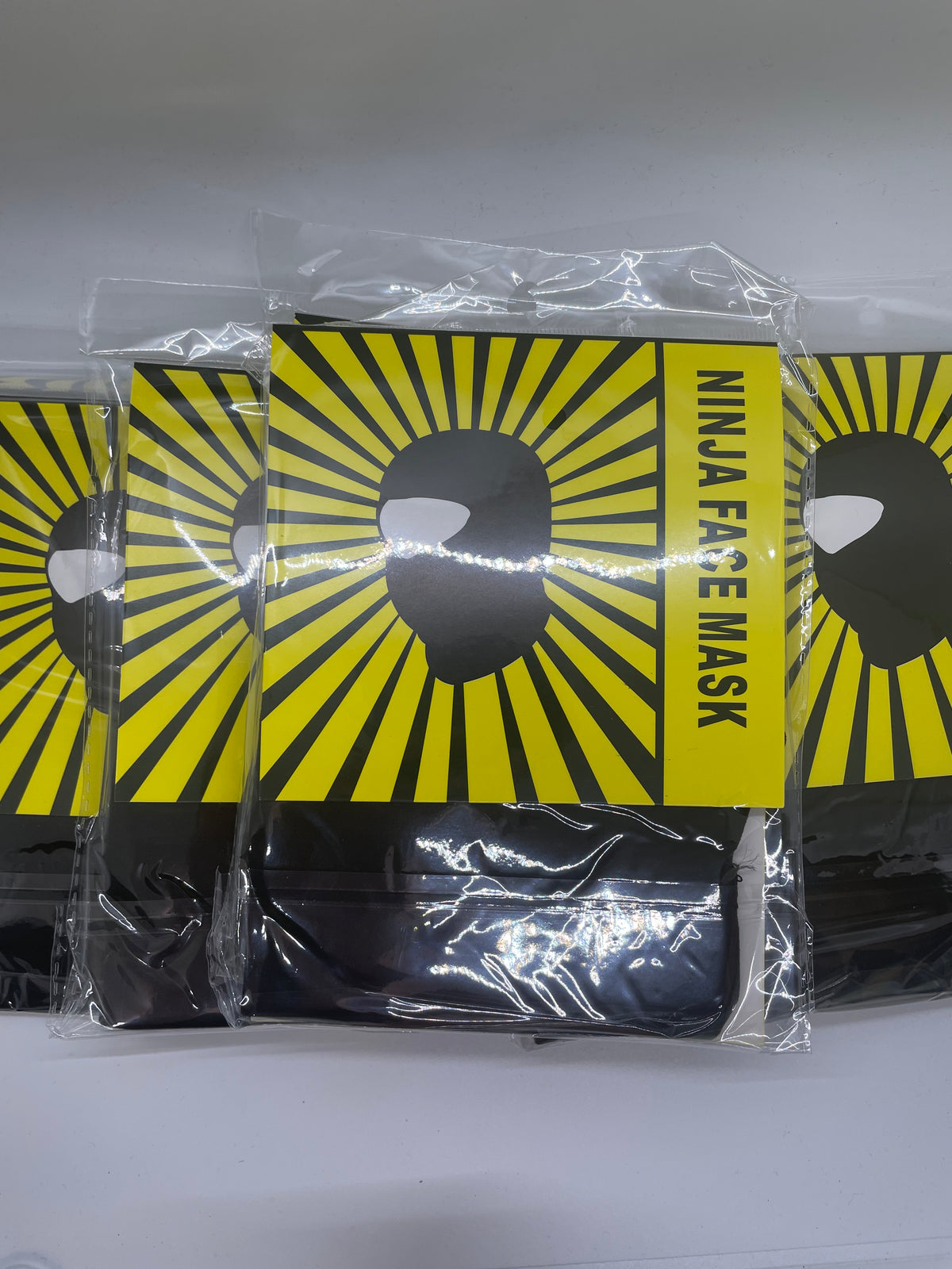 Packaged black ninja face masks