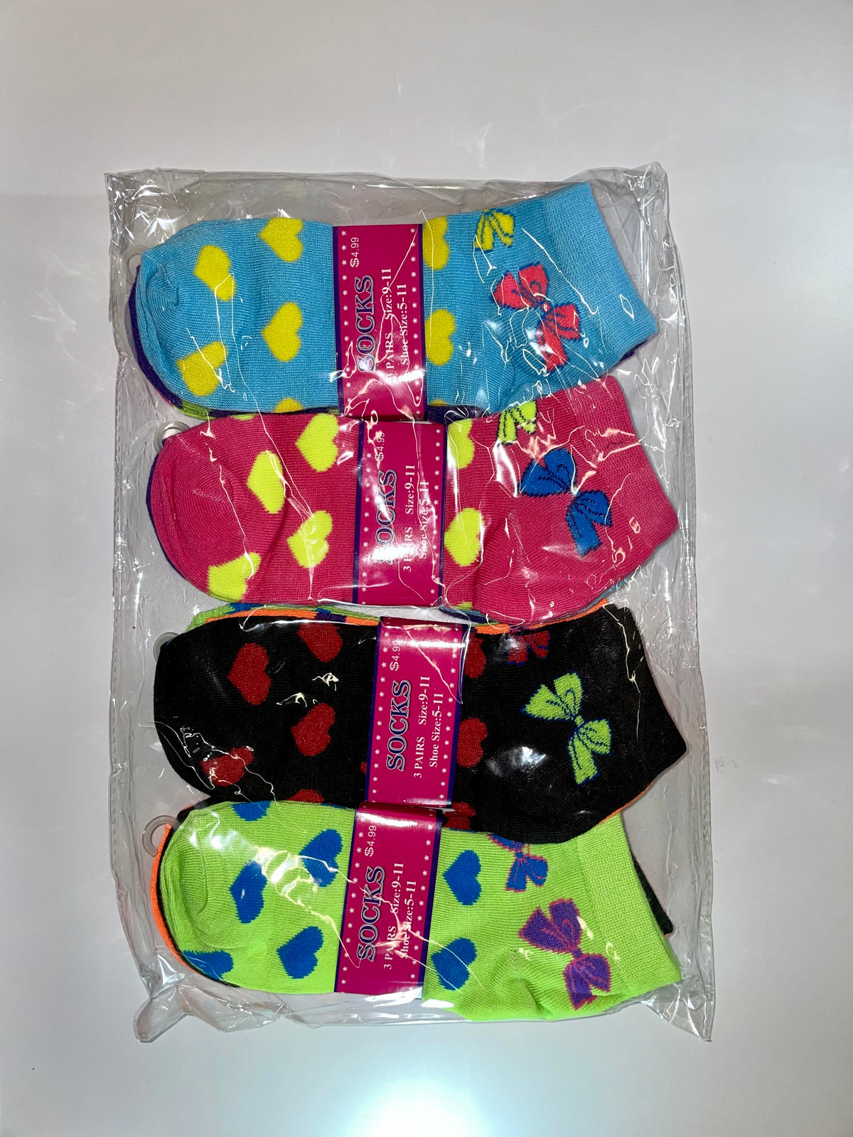 Packaged women’s ankle socks with lip patterns