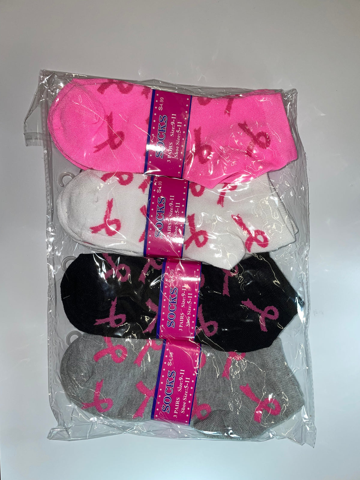 Packaged women’s ankle socks with pink ribbon designs