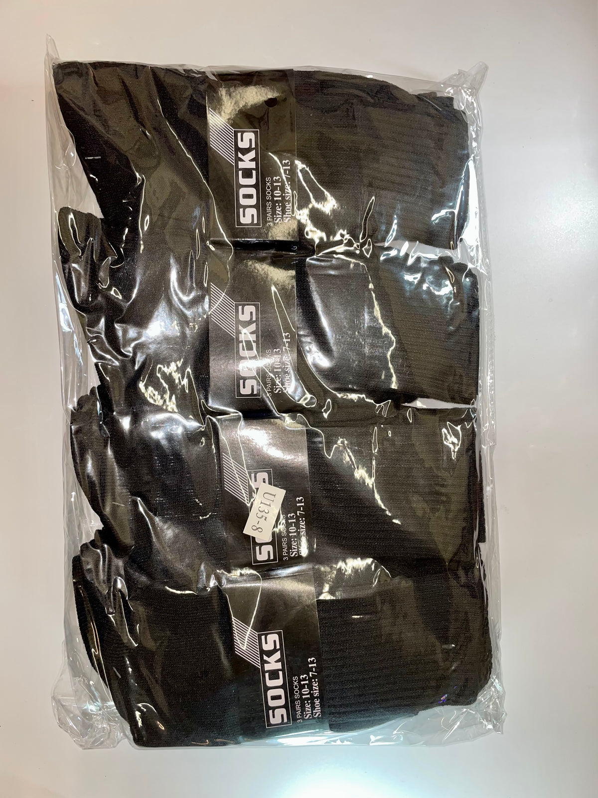 Packaged black crew socks
