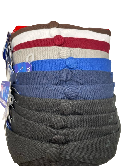 Stack of plain baseball hats in several colors