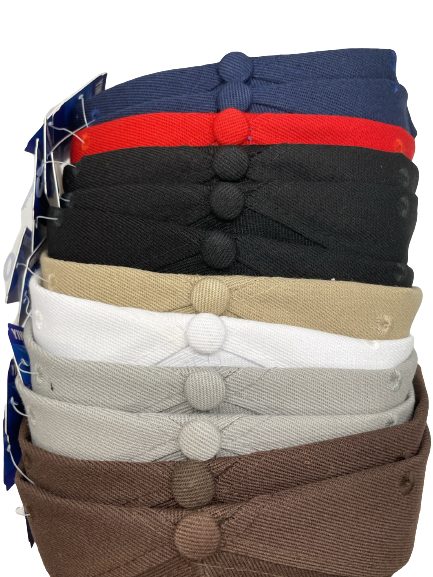 Stack of flat-brim baseball hats in several colors