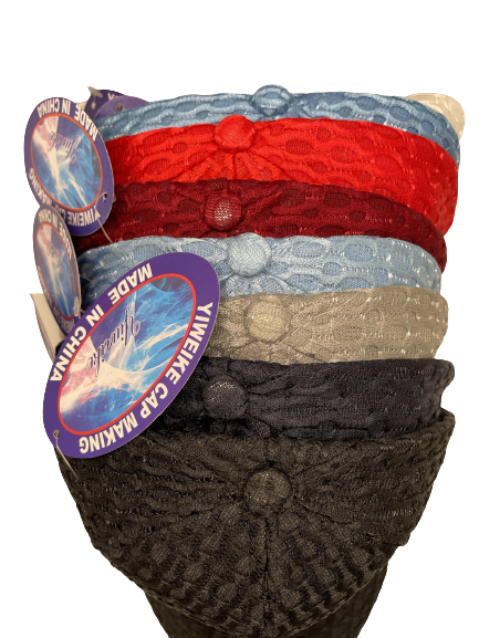 Stack of patterned netted baseball caps in several colors