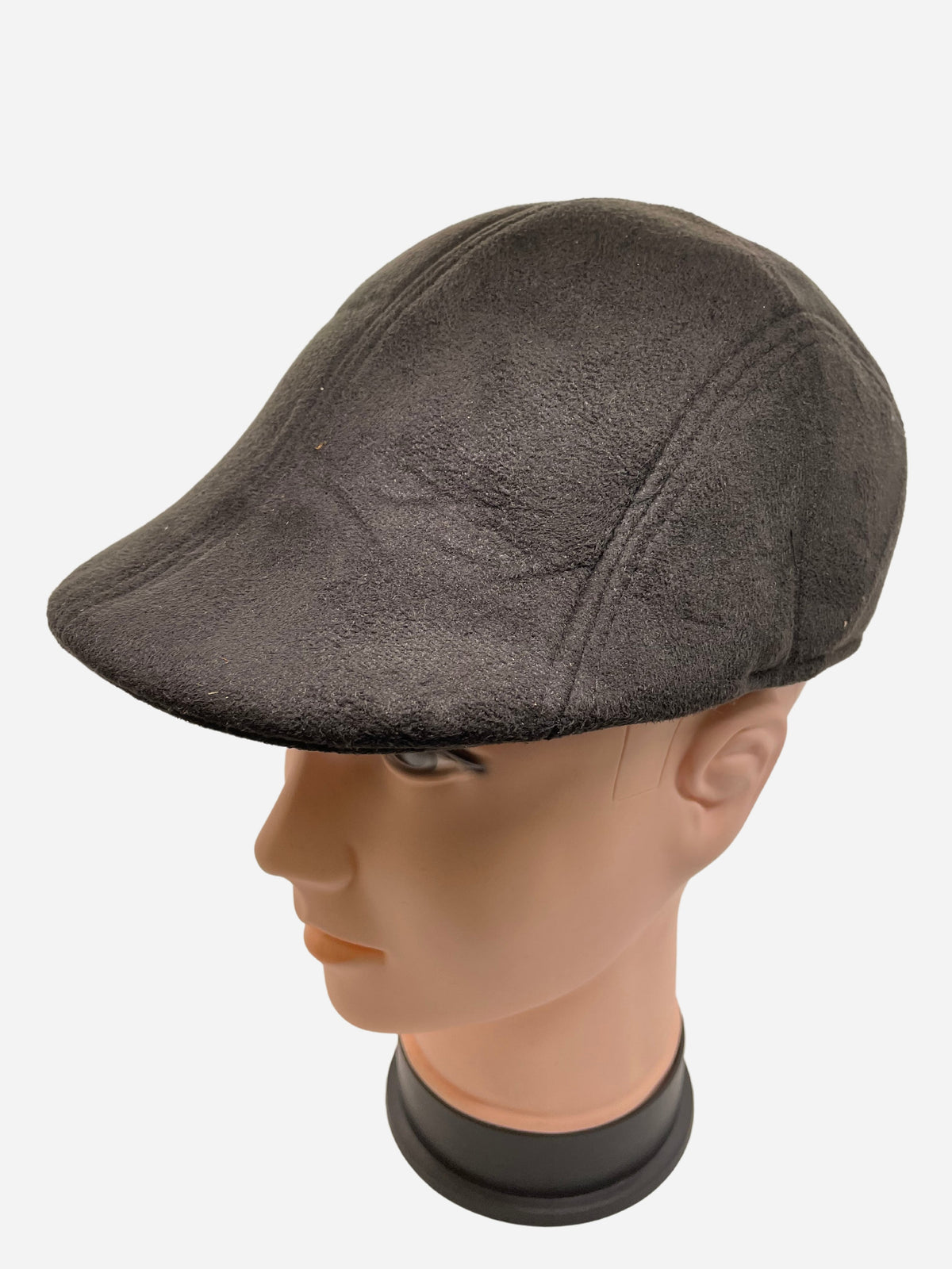 Dark paneled flat hat on a mannequin